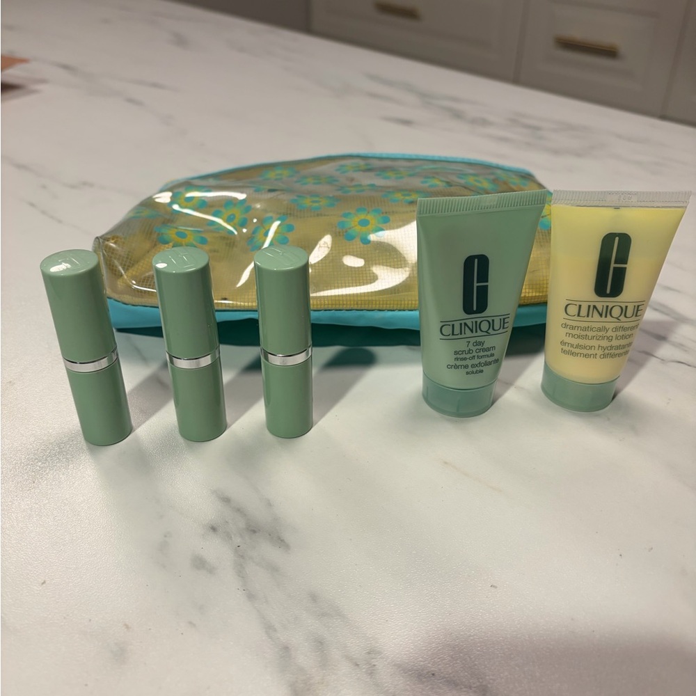 Clinique set of moisturizing lotion, 7 day scrub and 3 lipsticks
